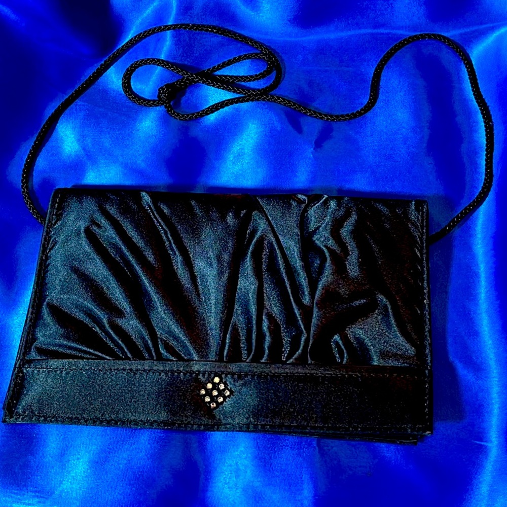 Vintage dressy black clutch with shimmering accent, hideable strap